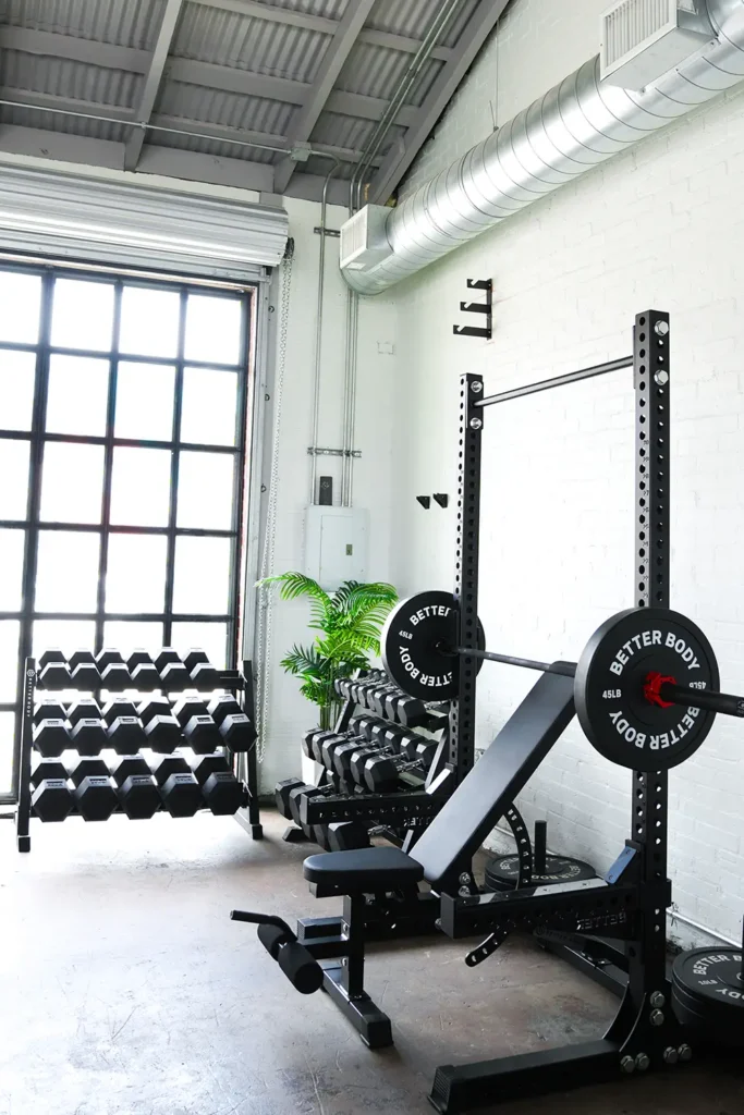 adjustable weight bench in a garage home gym setup used for incline and flat strength training exercises