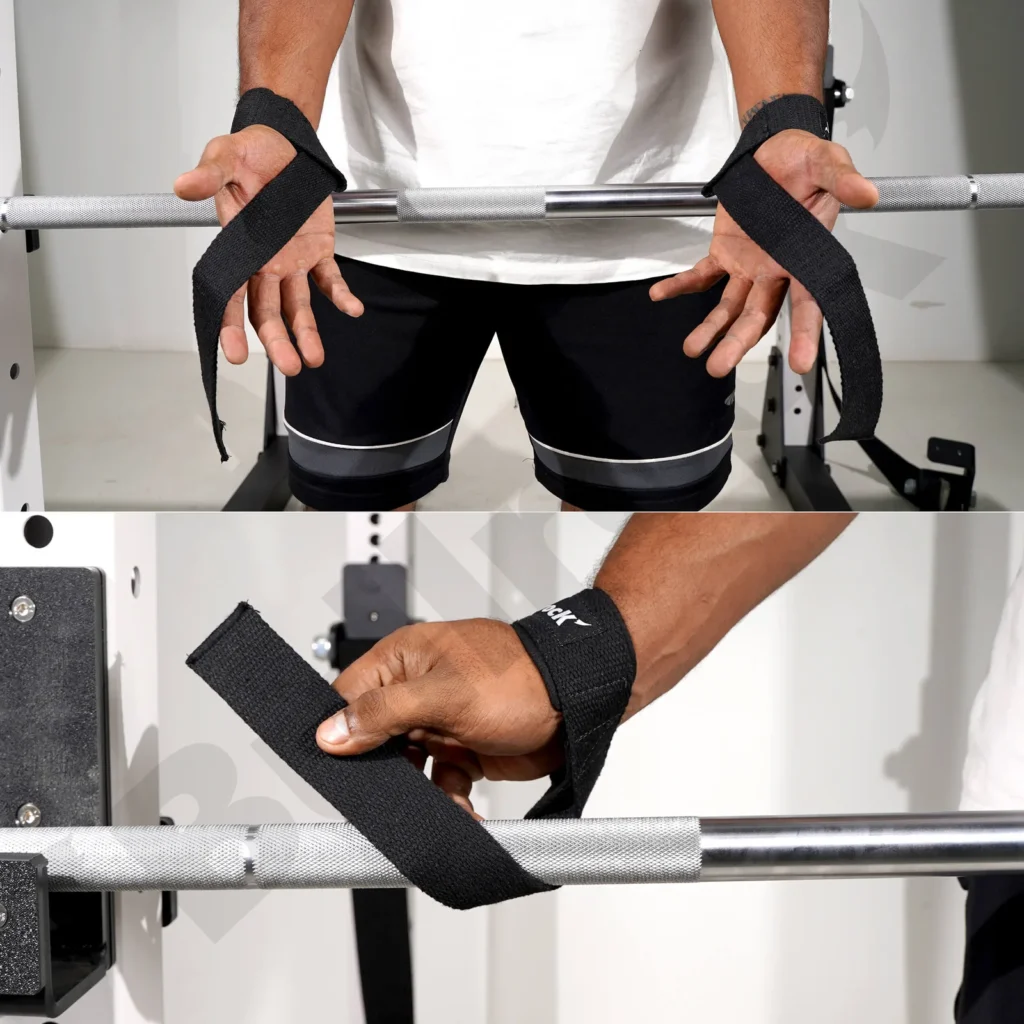 Weightlifter using lifting straps during a heavy deadlift in a home gym