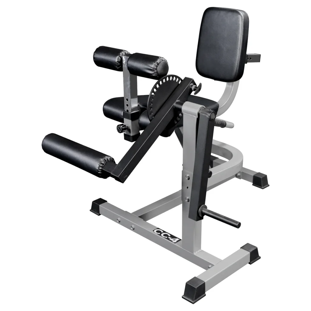 Plate loaded leg extension machine used in a home gym workout