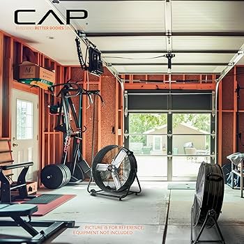 Garage home gym ventilation setup with fan and open door for airflow