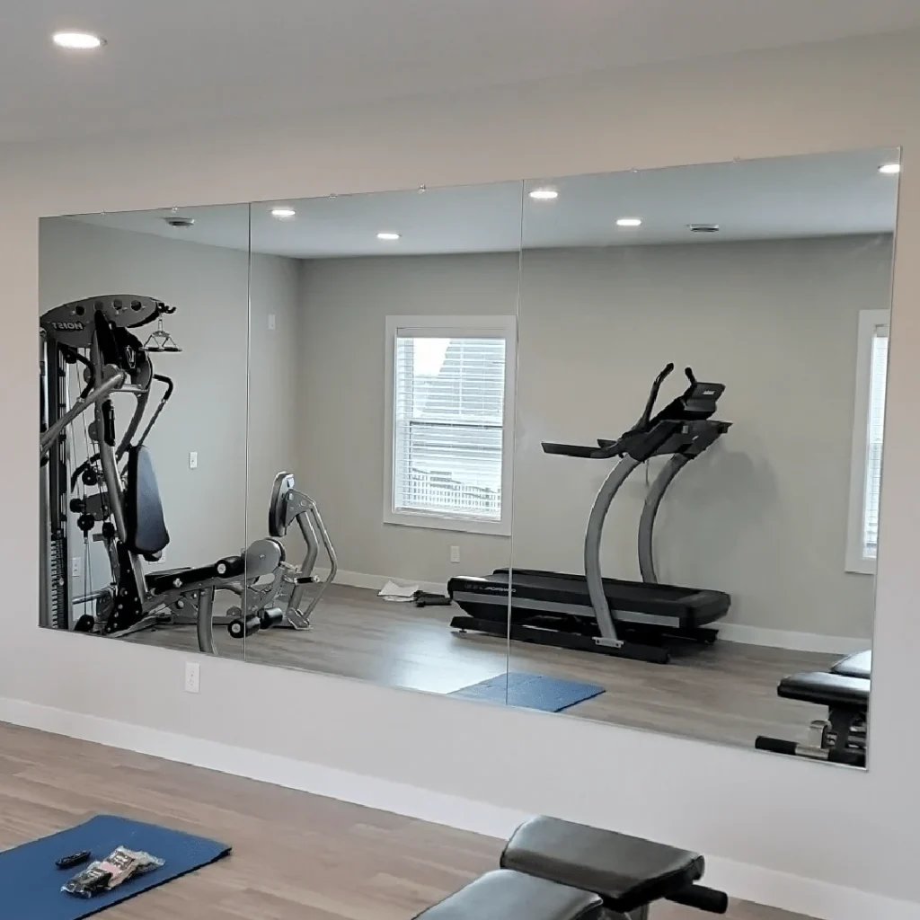 garage home gym with wall mounted mirrors for full body workout visibility