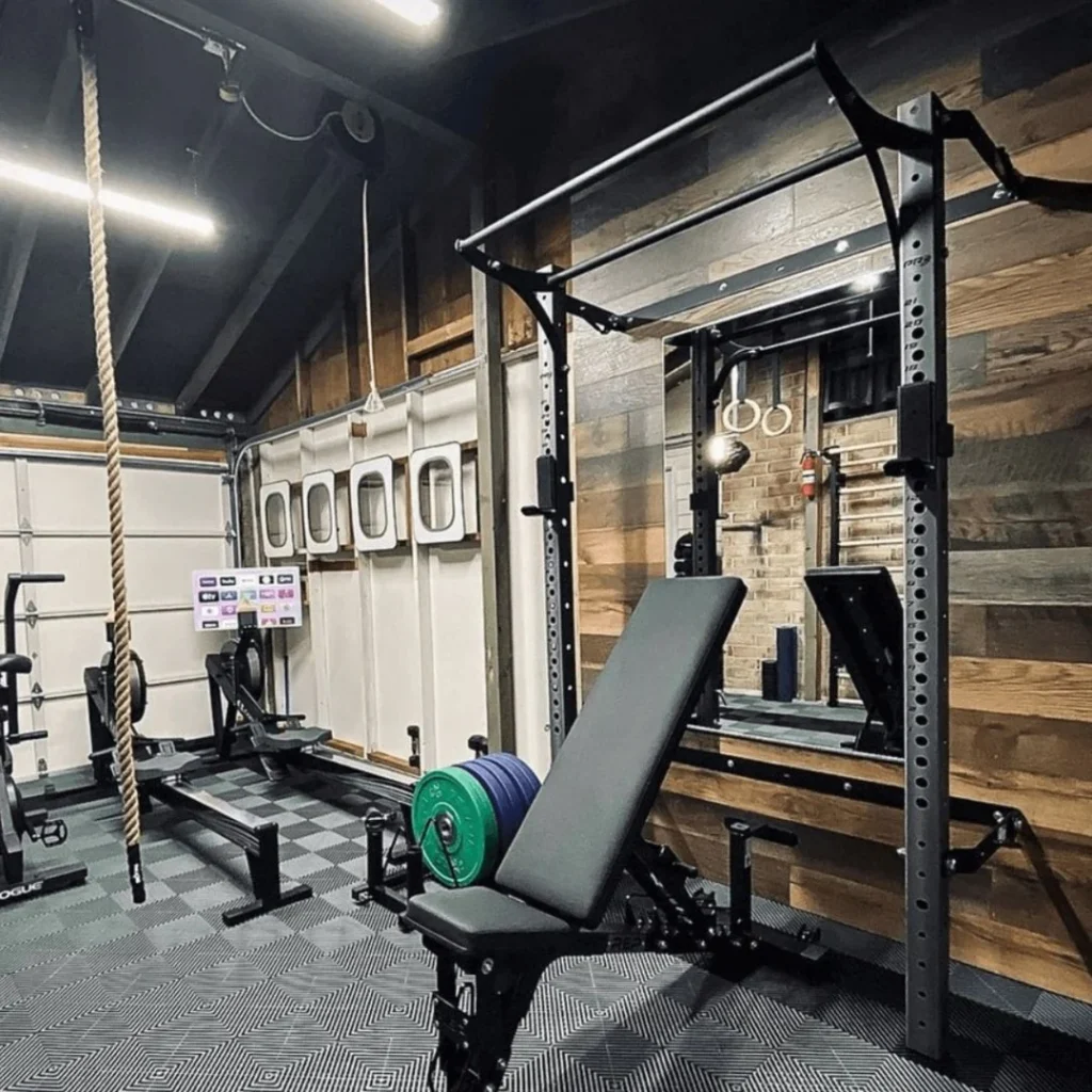 Shared garage home gym with foldable rack and organized layout