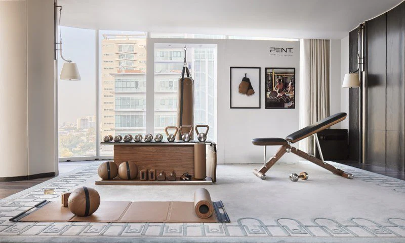 cardio vs strength training home gym setup with treadmill and weights