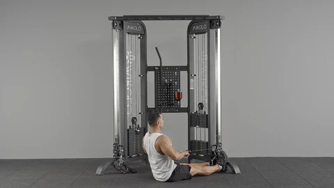 Home gym cable machine with lat pulldown bar and row handle attachments for back workouts