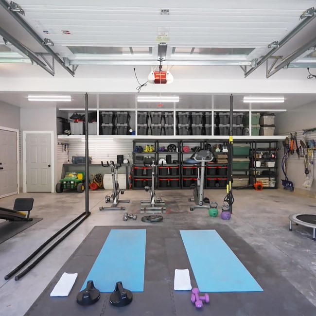 home gym layout with open space for functional training and organized equipment setup