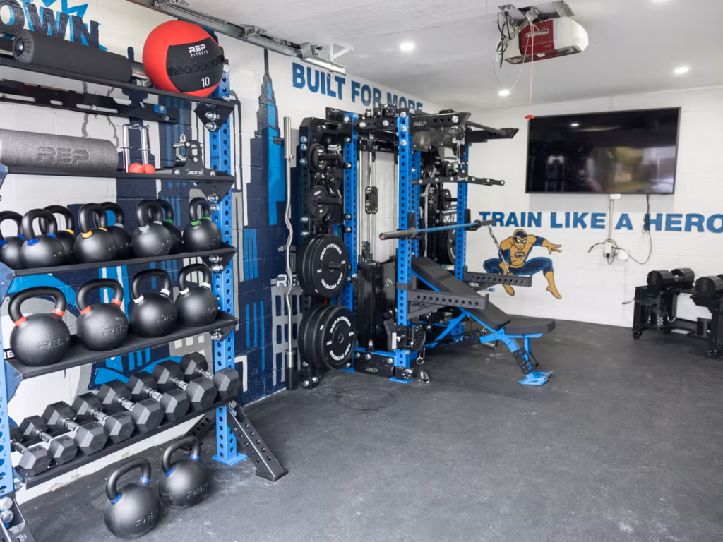 clean organized garage home gym with power rack bench and dumbbells